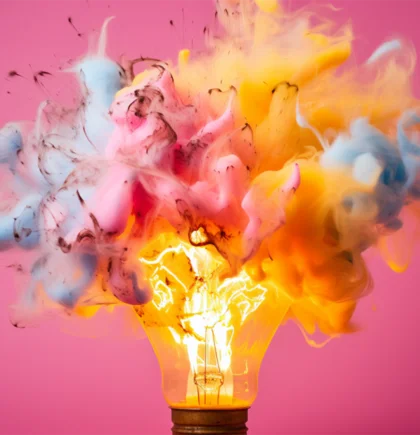 A lightbulb explodes in a burst of colorful smoke – symbolizing creative breakthroughs, new opportunities, and the risks of innovation