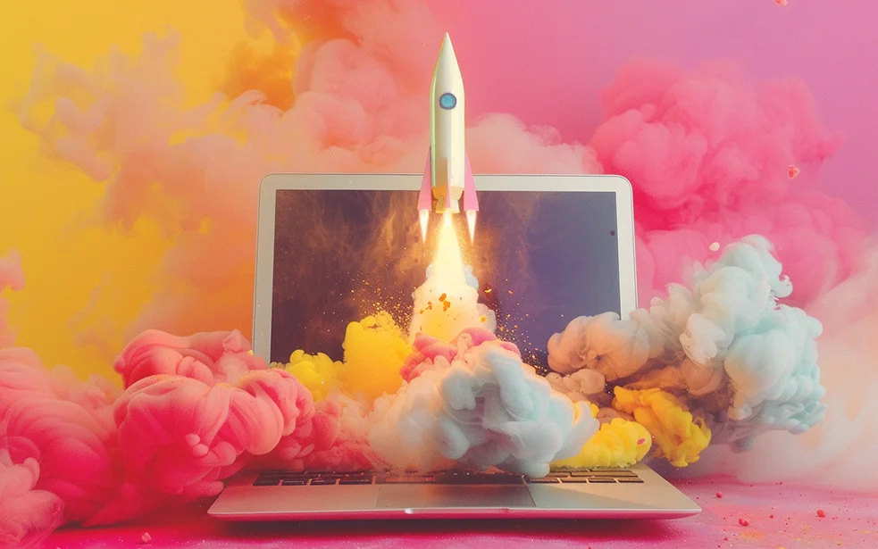 Eine Rakete steigt vom Laptop auf umgeben von bunten Rauchwolken